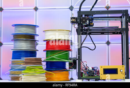 3D Printer and spools of plastic filaments Stock Photo