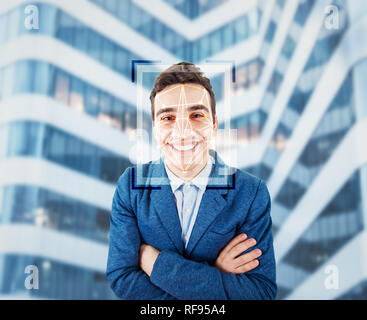 Young smiling man facial recognition system. Futuristic technology face id 3d scanning concept. Biometric verification and detection. Human identifica Stock Photo