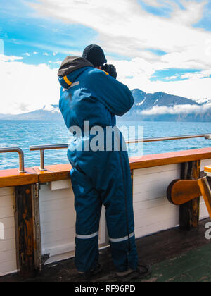 Photographer on an Eco-tourism and eco-friendly Eco-Friendly whale watching Tour in Iceland Stock Photo