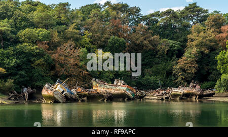 Old fishing boats in ship graveyard Stock Photo