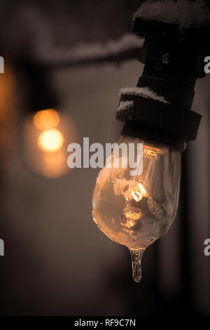 Color image of a frozen lit light bulb. Stock Photo