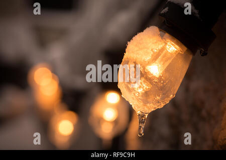 Color image of a frozen lit light bulb. Stock Photo