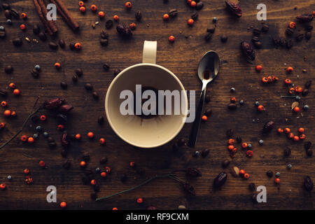 Empty coffee cup on table, top view rustic retro toned image Stock Photo