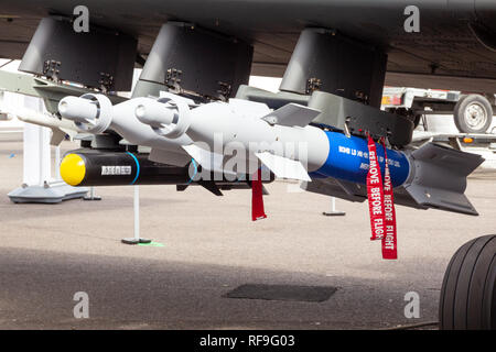 LE BOURGET PARIS - JUN 18, 2015: Various weapon pods under the wing of a military airplane showcased at the Paris Air Show. Stock Photo