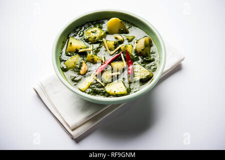Aloo Palak sabzi or Spinach Potatoes curry served in a bowl. Popular Indian healthy recipe. Selective focus Stock Photo