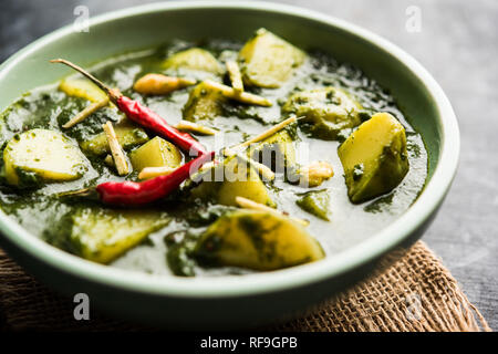 Aloo Palak sabzi or Spinach Potatoes curry served in a bowl. Popular Indian healthy recipe. Selective focus Stock Photo