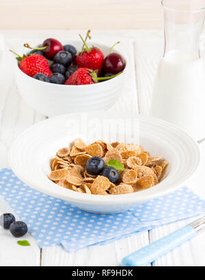 Multi-slag flakes for Breakfast with berries and milk, muesli, corn Stock Photo