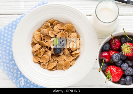 Multi-slag flakes for Breakfast with berries and milk, muesli, corn Stock Photo