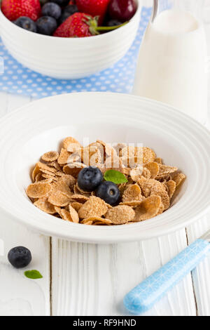 Multi-slag flakes for Breakfast with berries and milk, muesli, corn Stock Photo