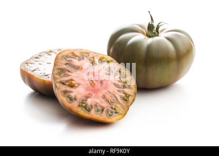 Dark brandywine tomatoes isolated on white background. Stock Photo