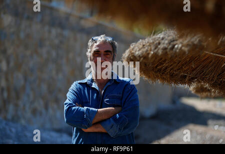 Pere Tantinia cofounder of La Fura dels Baus famous theatre company pose in Soller beach in Mallorca Stock Photo