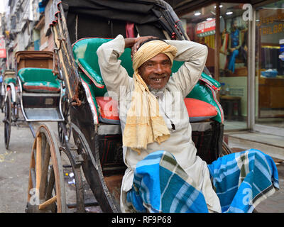 CALCUTTA, WEST BENGAL INDIA - 21 DECEMBER 2018: Rickshaw driver on crowded streets of Calcutta in the West Bengal Stock Photo