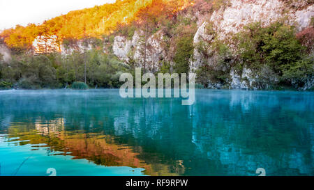 Misty Lake at dawn within the colorful Plitvice National Park in Croatia Stock Photo