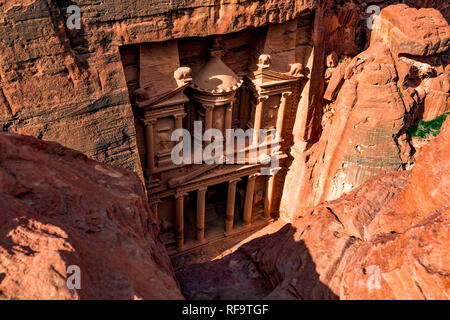 Spectacular view from above of Al Khazneh (The Treasury) in Petra during a sunny day.