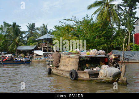 Phong Dien, Vietnam - December 31st 2017. A boat on the river at the Phong Dien Floating Market near Can Tho in the Mekong Delta Stock Photo