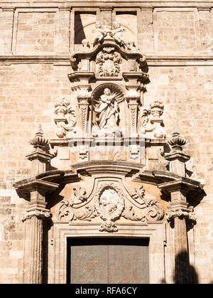 Ornate stone carved tympanum on the facade of the Església de Sant Joan del Mercat  in Valencia, Spain, Europe Stock Photo