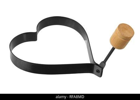 Heart shape form for fried egg isolated on white background Stock Photo