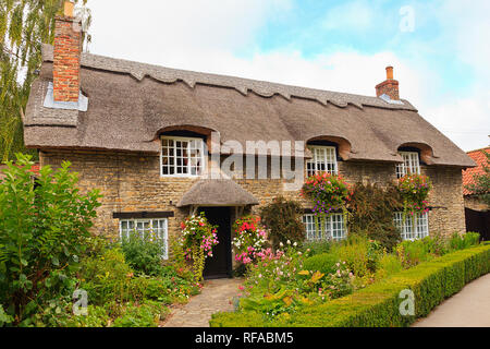 Thatched Cottage by the Beck in Thornton-le-Dale North Yorkshire Stock Photo