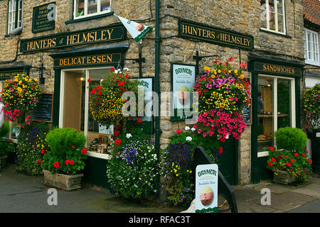 Colourful floral display on Delicatessen Shop in Helmsley North Yorkshire UK Stock Photo