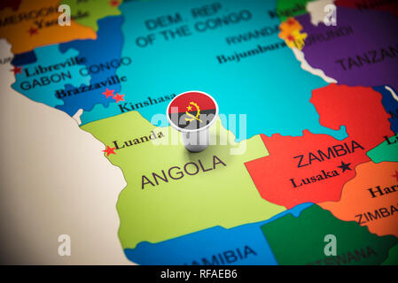 Angola marked with a flag on the map Stock Photo