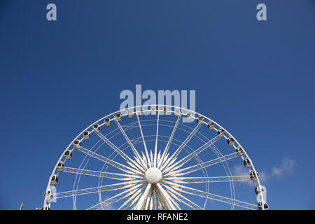 Shot with the sun still low in the sky it gives the Liverpool Ferris Wheel a white and gold glow which looks really cool, Europe Stock Photo