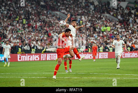 24th January 2019, Mohammed Bin Zayed Stadium, Abu Dhabi, United Arab Emirates; AFC Asian Cup football quarter final, China versus Iran; Morteza Pouraliganji of Iran heading the ball above Zhao Xuri of China Stock Photo