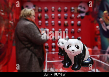 Berlin, Germany. 24th Jan, 2019. A visitor looks at exhibits in a shopping mall at Potsdamer Platz in Berlin, capital of Germany, on Jan. 24, 2019. 'Happy Chinese New Year,' a series of Chinese cultural celebrations for the upcoming Spring Festival, kicked off in downtown Berlin on Thursday. Credit: Shan Yuqi/Xinhua/Alamy Live News Stock Photo