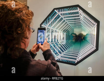 Beijing, USA. 23rd Jan, 2019. A visitor takes photos at the 24th Annual LA Art Show in Los Angeles, the United States, Jan. 23, 2019. Credit: Zhao Hanrong/Xinhua/Alamy Live News Stock Photo