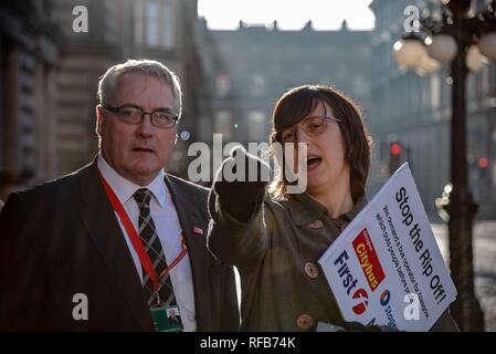 Glasgow, Renfrewshire, UK. 24th Jan, 2019. A woman seen holding a placard during the rally.The organization called Get Glasgow Moving held a protest outside of the City Chambers in Glasgow before handing over a box containing 10,727 signatures to members of the Council, saying that the transport should not be in the hands of private companies but in the publics. Credit: Stewart Kirby/SOPA Images/ZUMA Wire/Alamy Live News Stock Photo