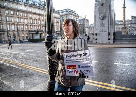 Glasgow, Renfrewshire, UK. 24th Jan, 2019. A woman is seen holding a placard during the rally.The organization called Get Glasgow Moving held a protest outside of the City Chambers in Glasgow before handing over a box containing 10,727 signatures to members of the Council, saying that the transport should not be in the hands of private companies but in the publics. Credit: Stewart Kirby/SOPA Images/ZUMA Wire/Alamy Live News Stock Photo