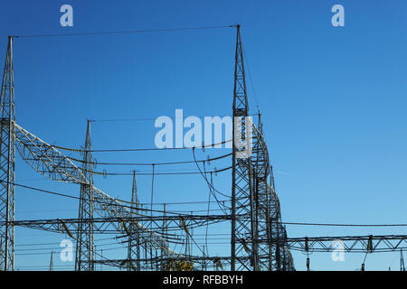 electric substation against the sky High-voltage electrical insulator electric line Stock Photo