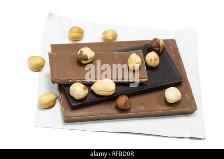 Chocolate with hazelnuts on white background Stock Photo