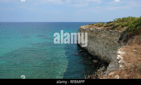 Beatiful cliffs at the Ionian Sea, in the province of Syracuse, Sicily. The beach is part of the Oriented Nature Reserve Cavagrande. Stock Photo