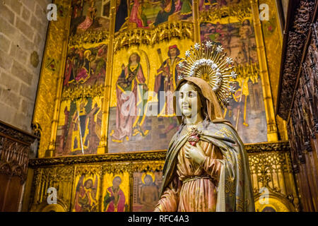 Carved wooden statue inside La Catedral de la Santa Creu i Santa Eulalia (Barcelona Cathedral) Stock Photo