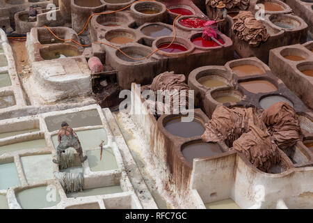 The traditional hand made Leather production in the old City in the historical Town of Fes in Morocco in north Africa. Morocco, Fes, Africa Stock Photo