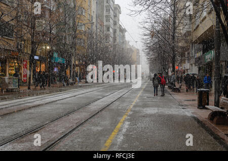 ESKİSEHİR,TURKEY-January 15,2019:Snowfall in the city. People are walking on the street in winter, under snowfall Stock Photo