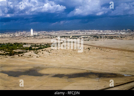 Dubai. Aerial views of Dubai with the Dubai Trade Centre Tower looking towards towards the coast in 1986 Stock Photo