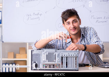 Young it specialist in front of the whiteboard Stock Photo