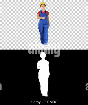 On Alpha Matte. Full length shot. Confident experienced forewoman walking with will to work, Alpha Channel Professional shot in 4K resolution. 006. Yo Stock Photo