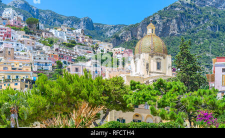 The Church of Santa Maria Assunta, nested in the seaside town of Positano on the Amalfi coast near Sorrento in Italy Stock Photo