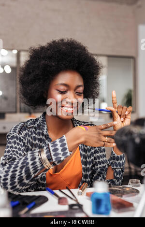 Beautiful dark-skinned african american woman feeling happy Stock Photo