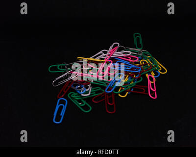 colourfull paperclips with a black background Stock Photo