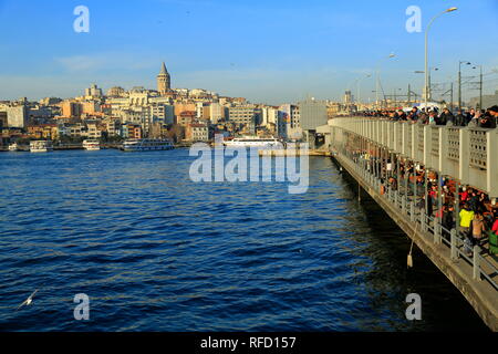 Istanbul, Turkey - Historic Galata Bridge. The historic bridge where amateur fishermen always fishing, along with pedestrian and car crossing. Stock Photo