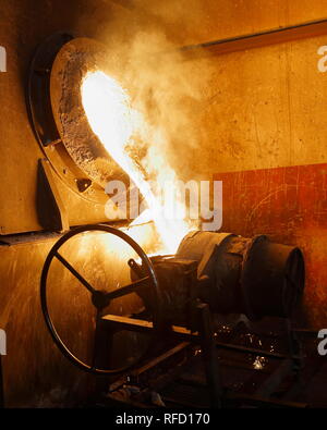 View of a workshop making cast iron production. Preparation of molten iron to be poured into molds. Stock Photo