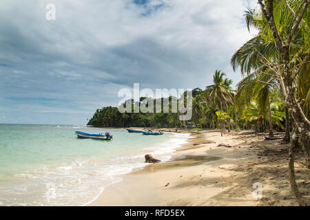 A scenic landscape photo of a wild and beautiful sandy beach at tropical Manzanillo - the romantic Caribbean side Costa Rica. Stock Photo