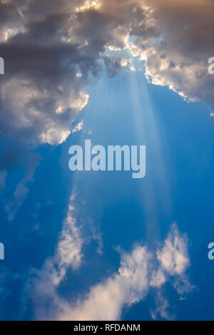 The sun shines through the clouds Stock Photo
