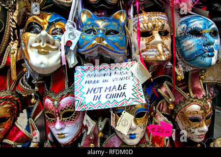 Genuine Venitian masks displayed for sale in Venice. Stock Photo