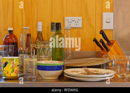 Time to do the dishes and the housework. Stock Photo