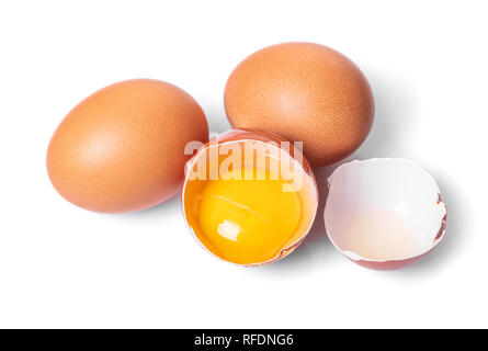 broken and whole chicken eggs on white isolated background Stock Photo
