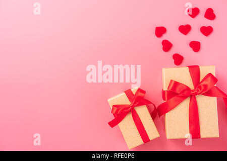 Giving present and celebration concept at Valentine's day, anniversary, mother's day and birthday surprise on pink background, copyspace, topview Stock Photo